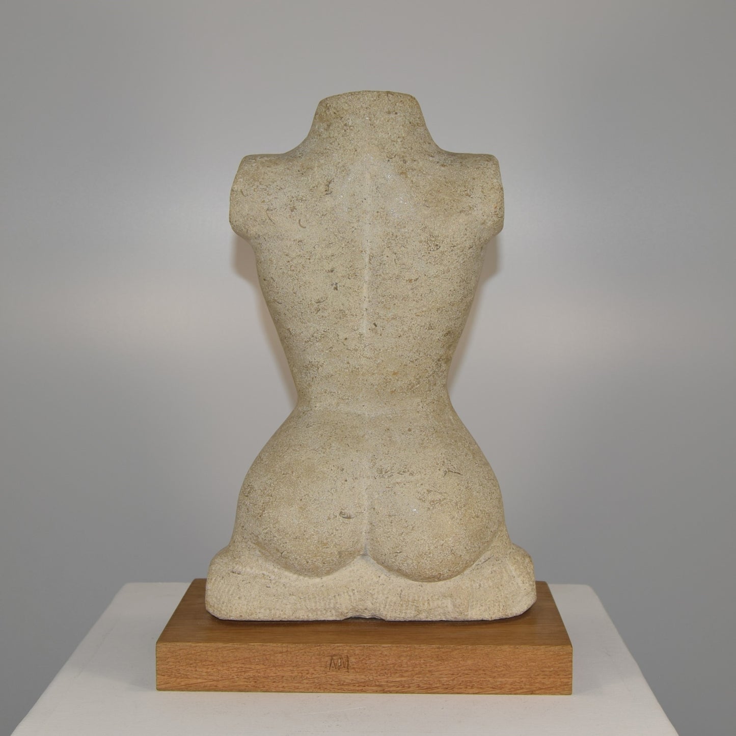 Female Torso in Portland Stone signed MM