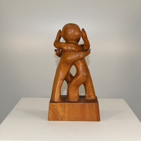 Abstract Embracing Backstabbing Figures in Oak