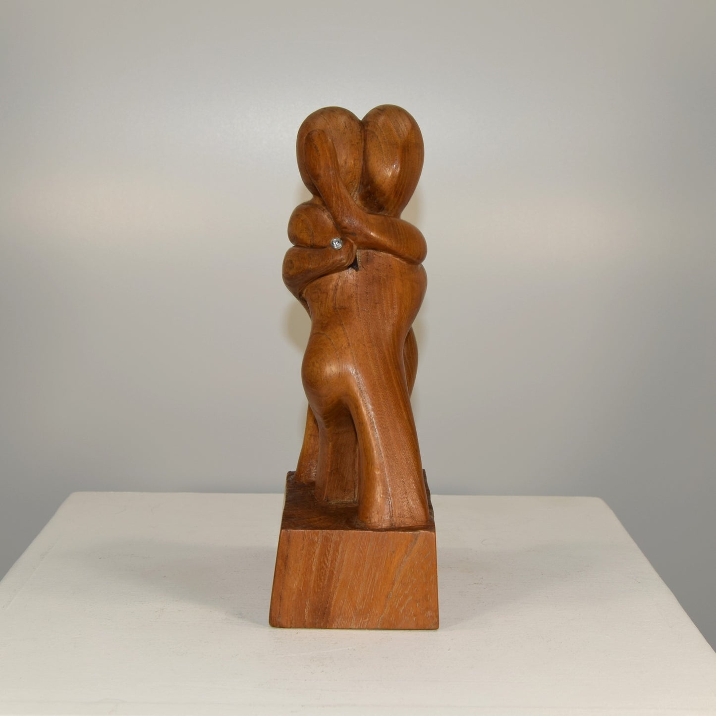 Abstract Embracing Backstabbing Figures in Oak