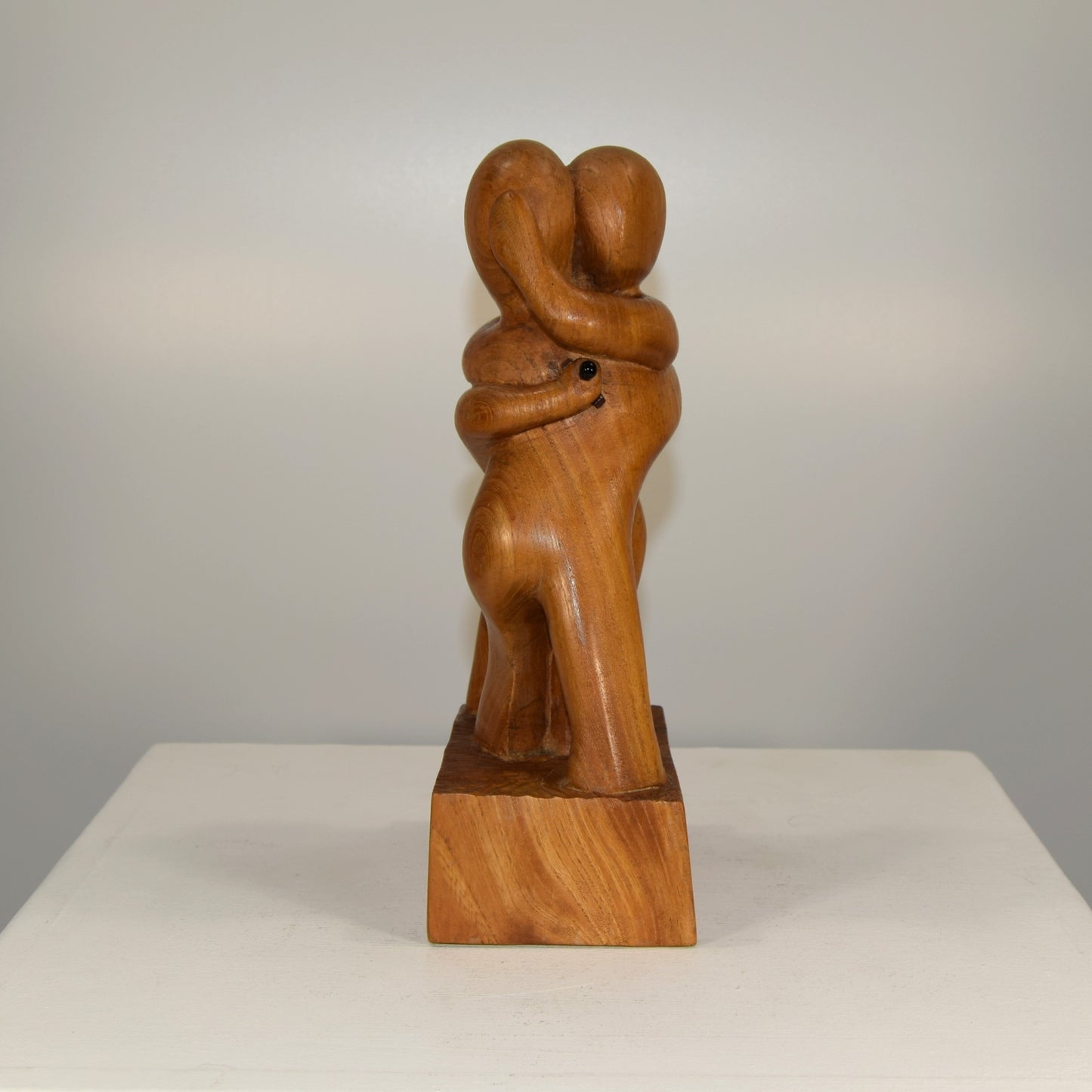 Abstract Embracing Backstabbing Figures in Oak