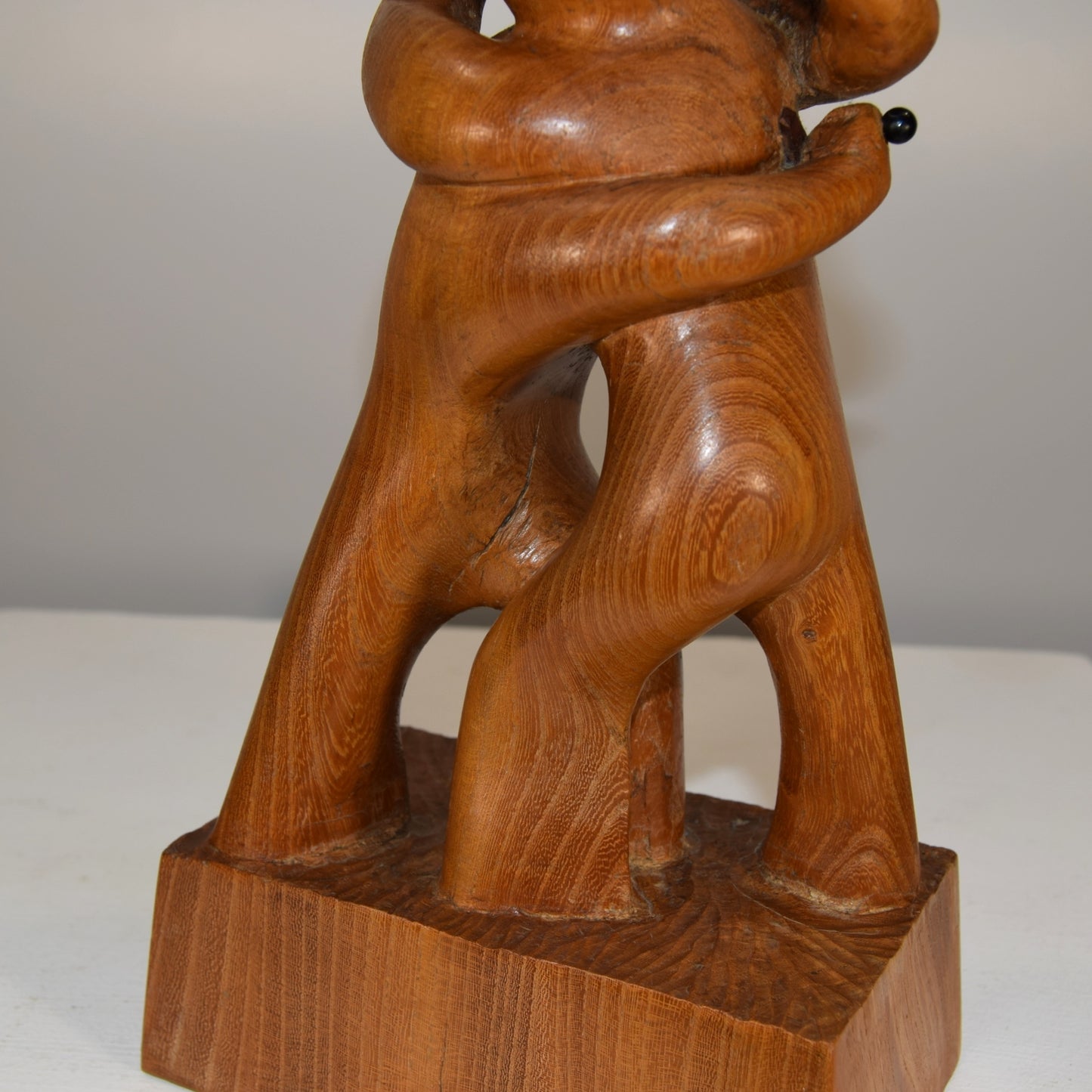 Abstract Embracing Backstabbing Figures in Oak