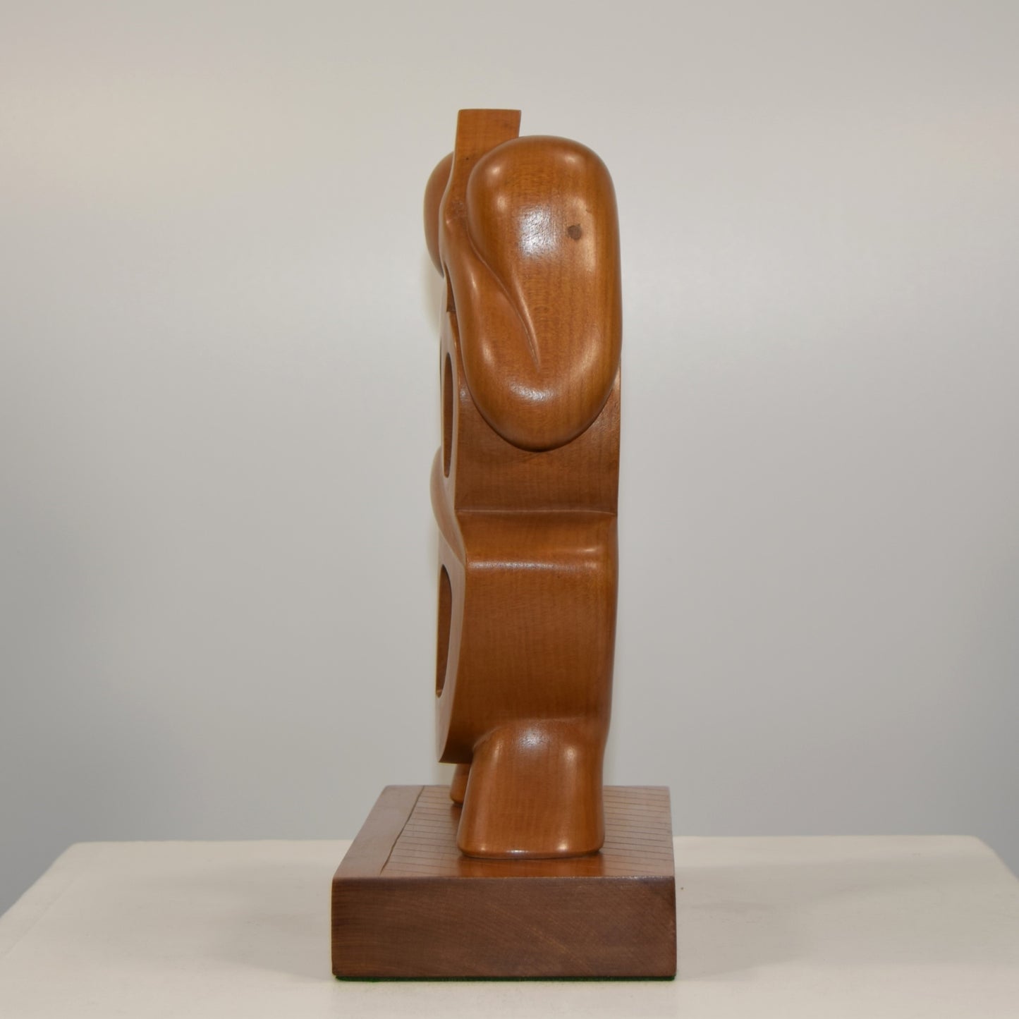 J Owens Abstract Cellist in Fruit Wood dated 1980