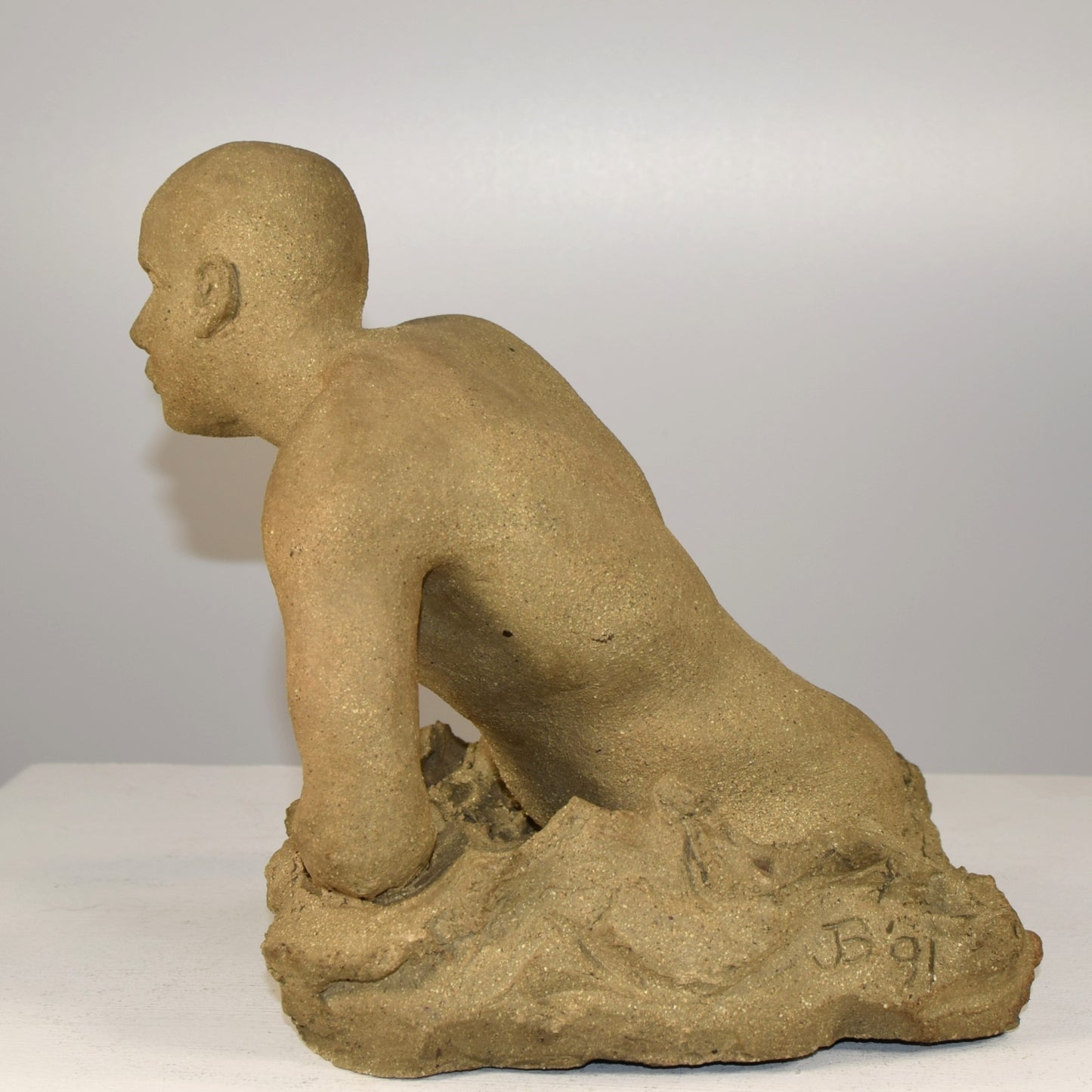 Stoneware Male Emerging Signed  JB  Dated 1991